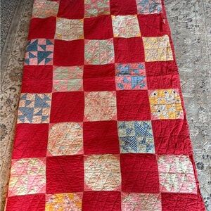 Patchwork Quilt with Red Accents